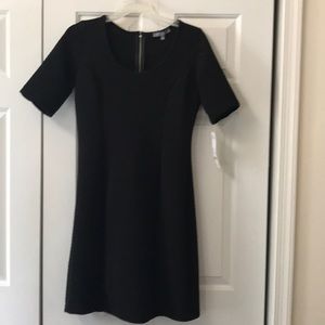 Black knee length dress with silver zipper
